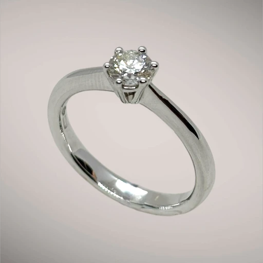 Anello in oro kt18 con diamante taglio brillante ct0,40 G SI
